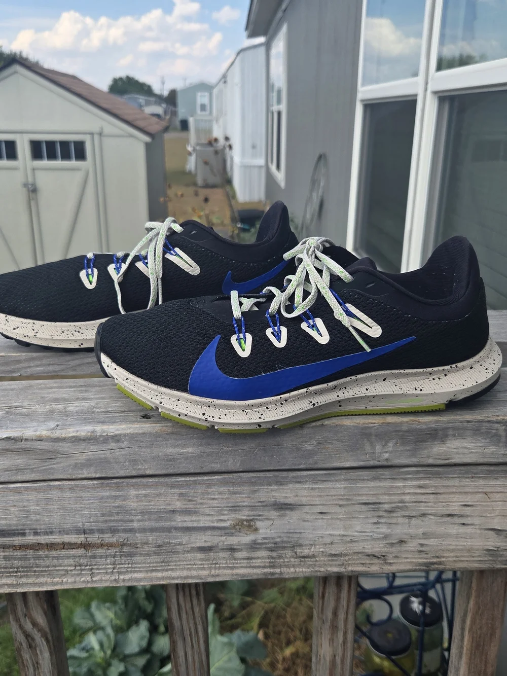 Nike Men’s Black Running Shoes with Blue Swoosh